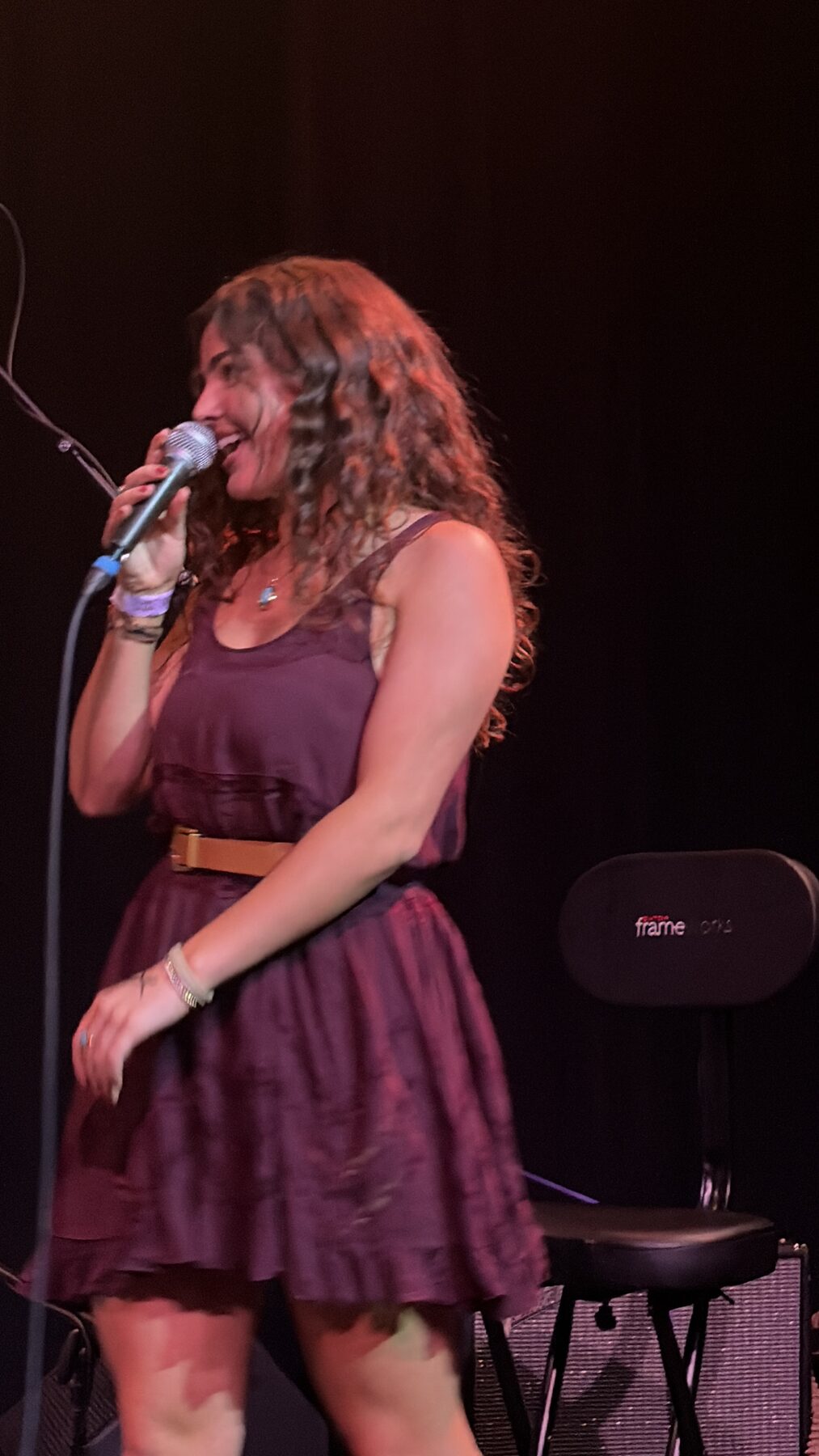 Kailey Jane laughing mid-song at Pearl Street Warehouse